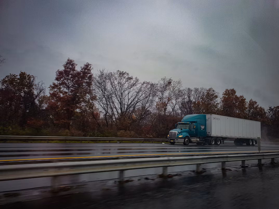 Semi truck on the highway representing Velocity Freight Management's mission